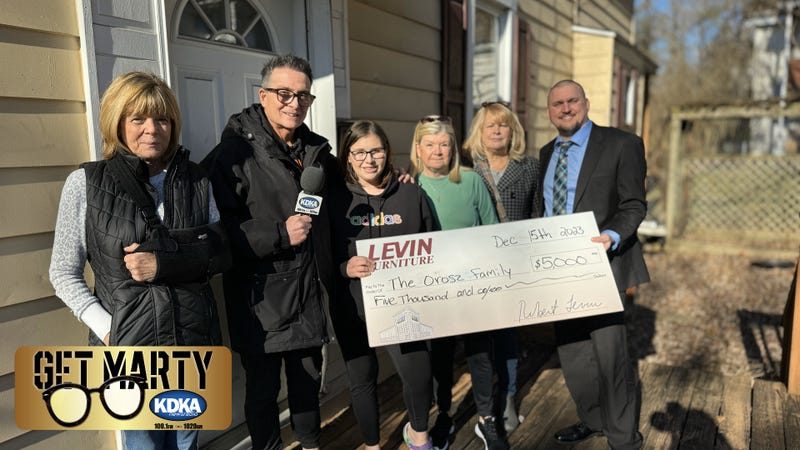 Jennifer Orosz receives $5,000 surprise from Levin's Furniture & Mattress for Christmas.