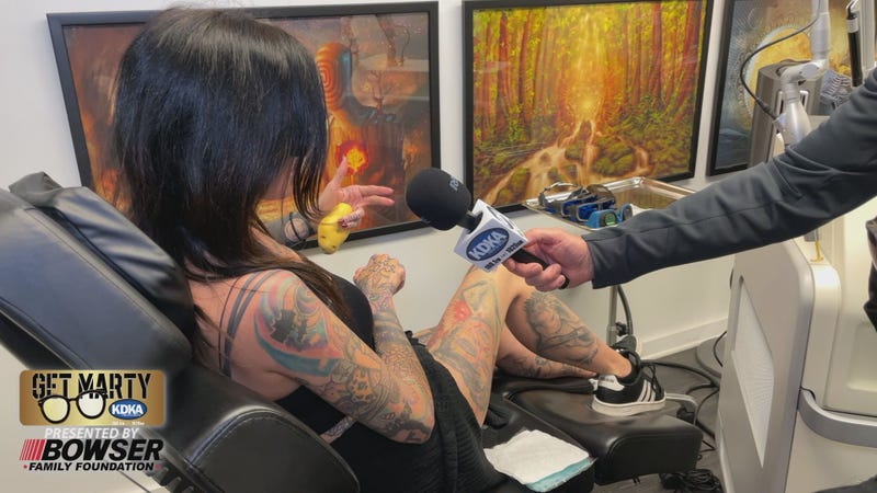 Woman gets laser treatment to remove old ink and prepare for new tattoo