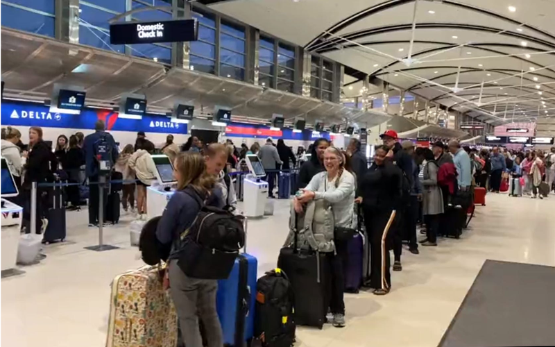 Travelers at Detroit Metro Airport