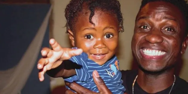 Jimmy Amisial and Emilio, the 4-year-old he found in the trash as a baby.