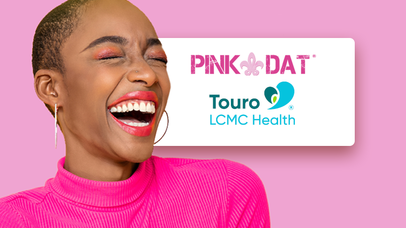 happy women with Touro and Pink Dat logos