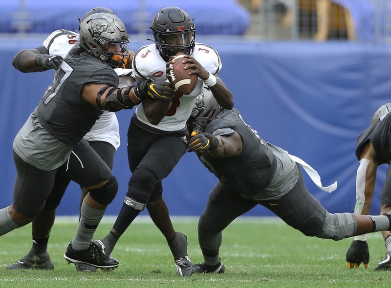 Pittsburgh Panthers defensive lineman Rashad Weaver (17) and defensive lineman Keyshon Camp (10) sack Louisville Cardinals quarterback cduring the third quarter at Heinz Field. Pittsburgh won 23-20.