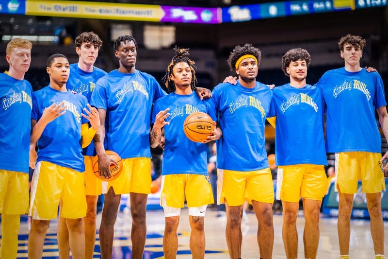 Pitt players wearing shirts honoring Hamlin