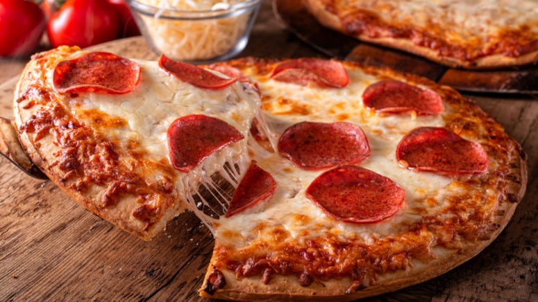 Man raises 30k for charity making pizza at home and dropping slices out of his window