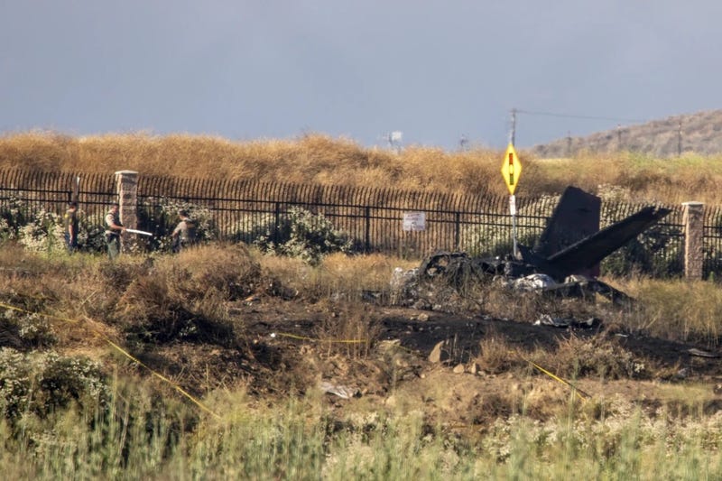 Charred remains of a Cessna lie near the landing approach at French Valley Airport, in Murrieta, Calif., Saturday, July 8, 2023.
