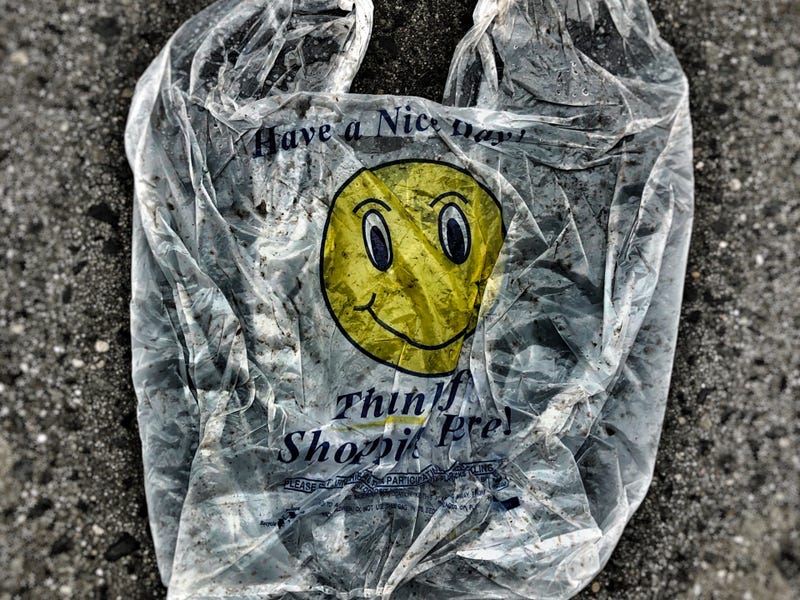 Have a Nice Day, discarded plastic bag in streets, Queens, New York.