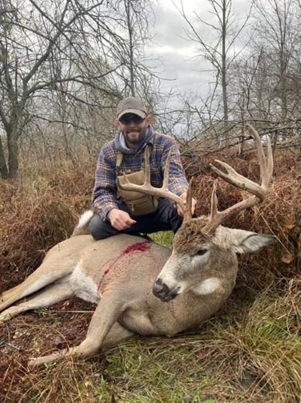 Zorda poses with deer taken illegally in Erie County.