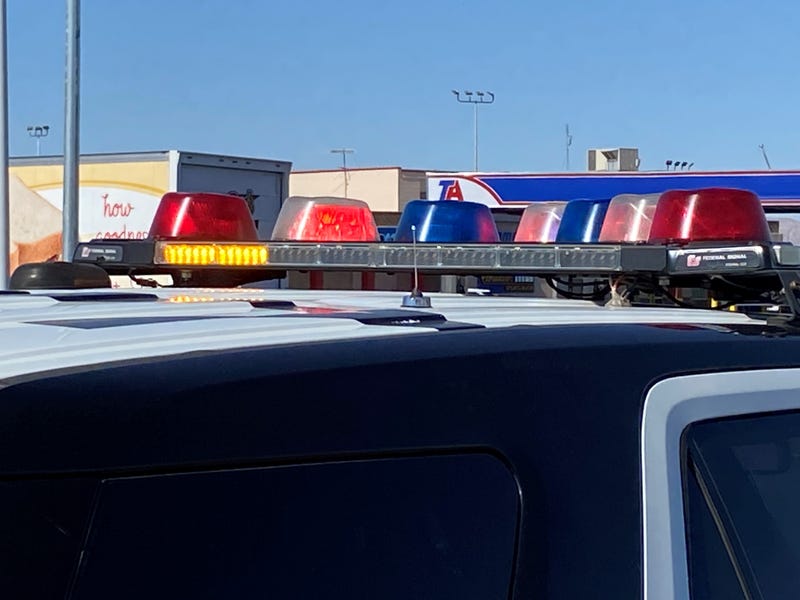 Police squads converge on a crime scene