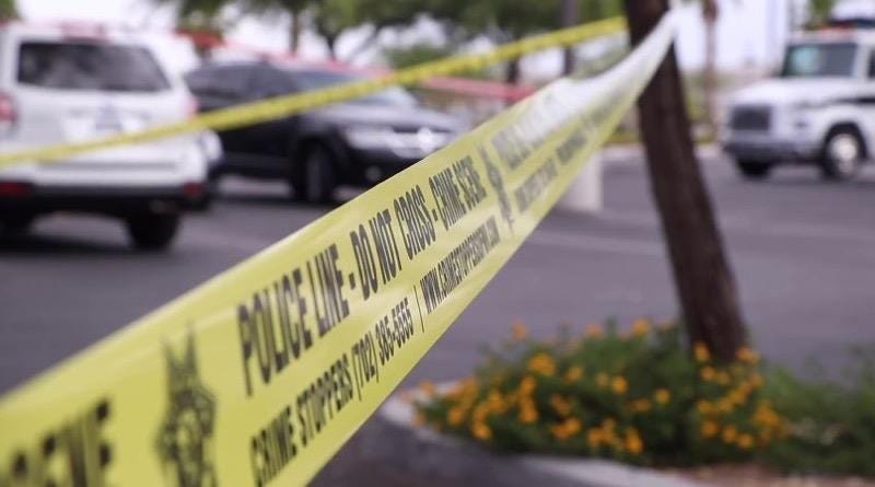 Yellow tape ropes off a crime scene investigation
