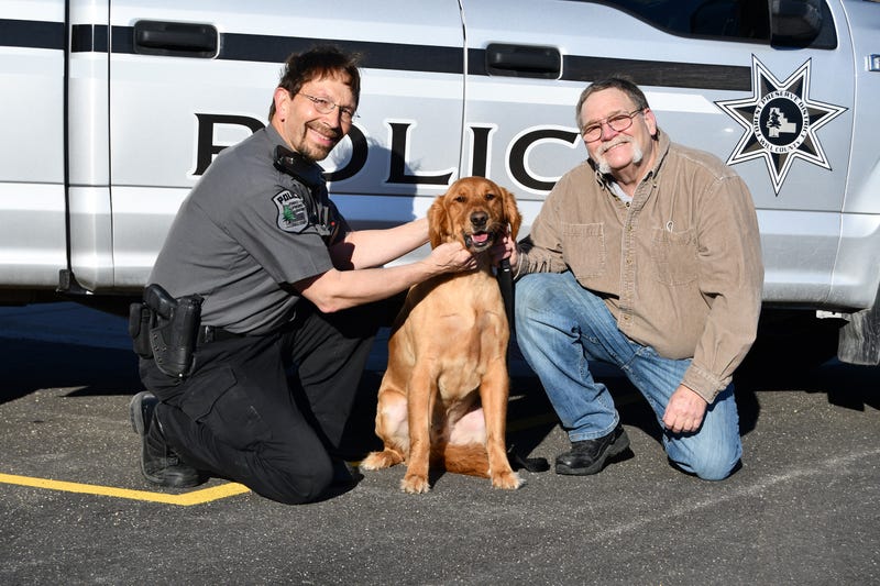 Forest Preserve District of Will County Police Officer Dan Rankovich and Frankfort resident Kim Jones pose with Jones’ dog Rocco, who ran out onto the ice at Monee Reservoir on March 5 and was rescued from the frigid water by Monee firefighters with assistance from Rankovich.