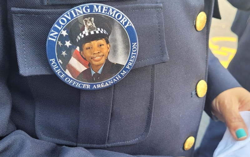 Fire official with button honoring slain officer
