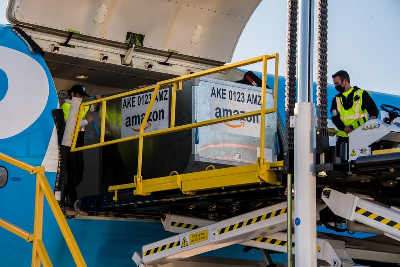 Cargo is loaded onto Amazon Air for the company's first flight out of Pittsburgh International Airport on May 13, 2021