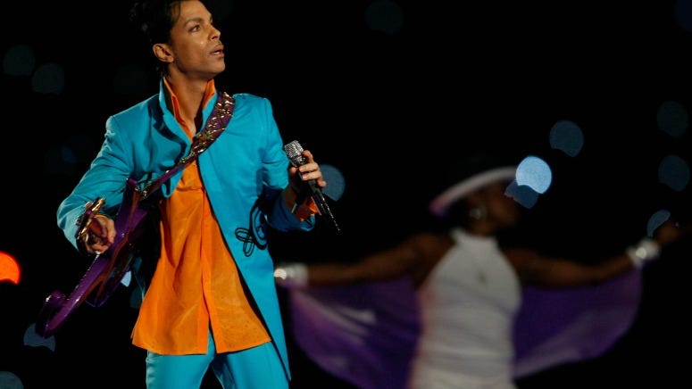 The Story Behind Prince's Epic 'While My Guitar Gently Weeps' Guitar Solo
