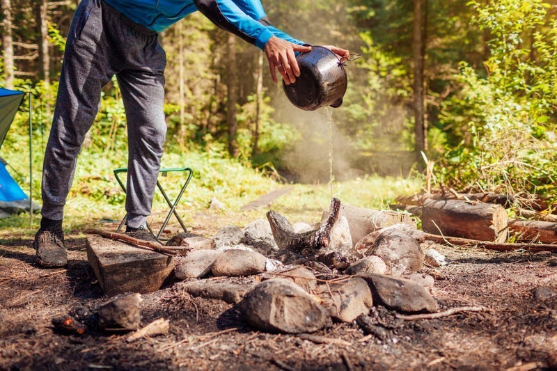 putting out camp fire