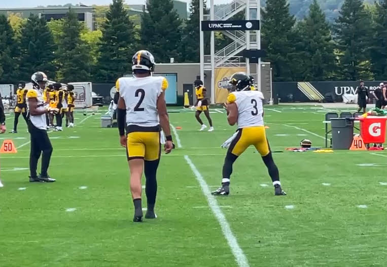 Russell Wilson and Justin Fields at practice