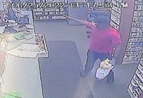 Police in Canton are on the hunt for a suspect they accuse of holding up a local pharmacy clerk at gunpoint and demanding pills and cash.