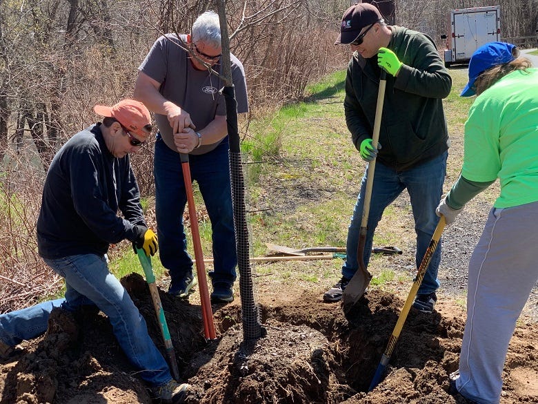 How many radio people does it take to dig a hole?