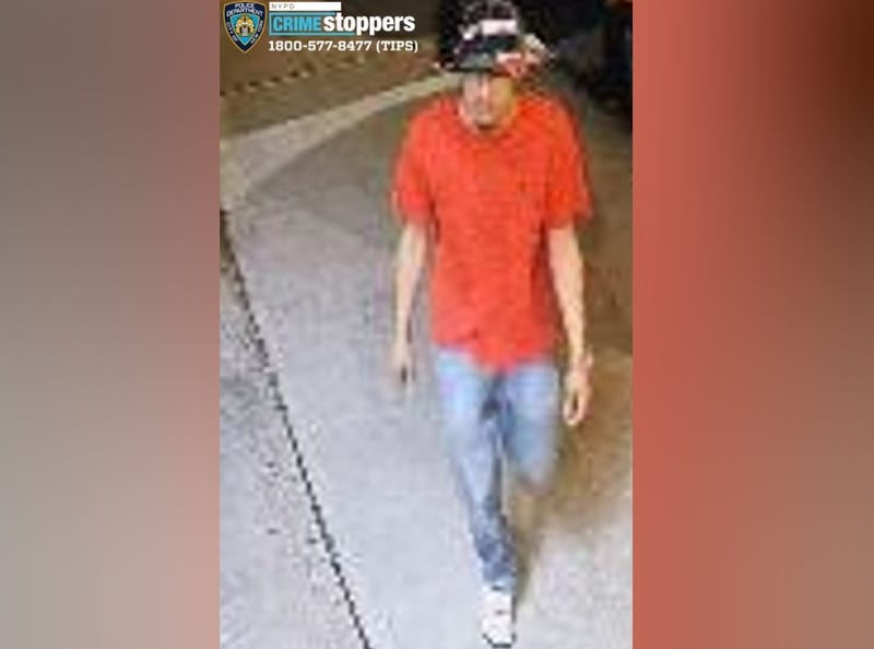 The NYPD released an image Friday of the suspect wearing a bright red shirt and a bucket hat