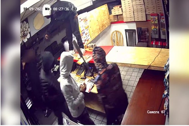 Police believe the same group held up two employees at Bally’s Pizza on Mascher Street in Olney earlier that night. They released surveillance video which shows at least four men: two armed, and another with a long broken pipe, forcing one employee to open a cash register, with one pointing a gun at him and another holding a pipe over him, as the victim is holding his hands up in a surrender gesture.