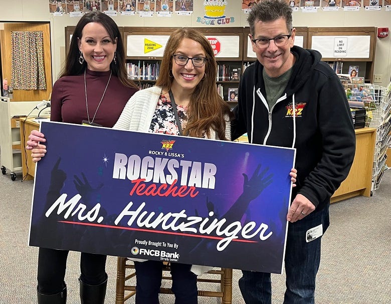 Rockstar Teacher winner Mrs. Huntzinger with Rocky & Lissa
