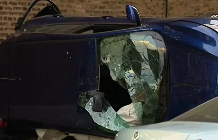 totaled car on its side