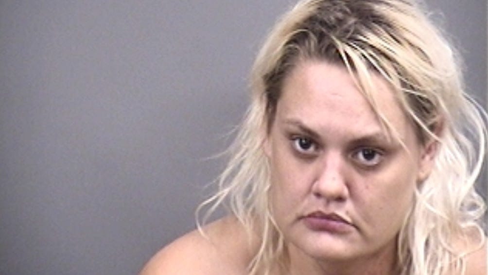 Woman slips handcuffs, smashes patrol car window and shoots cop with an AR-15