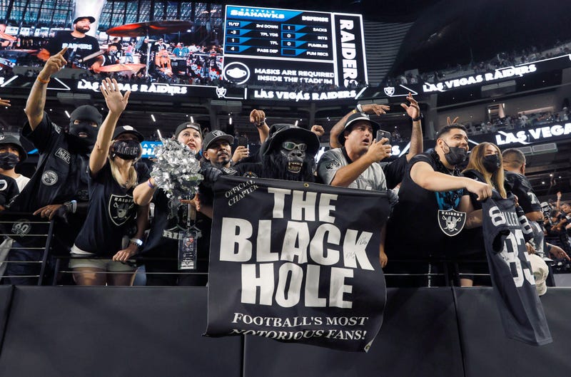 as Vegas Raiders fans, including Mark "Gorilla Rilla" Acasio (C), react as players walk off the field following the team's 20-7 victory over the Seattle Seahawks during a preseason game at Allegiant Stadium on August 14, 2021 in Las Vegas, Nevada.