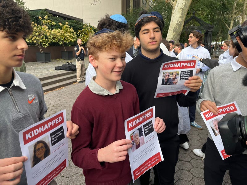 Demonstrators gathered at a rally calling on Hamas to release Israeli captives Wednesday morning.