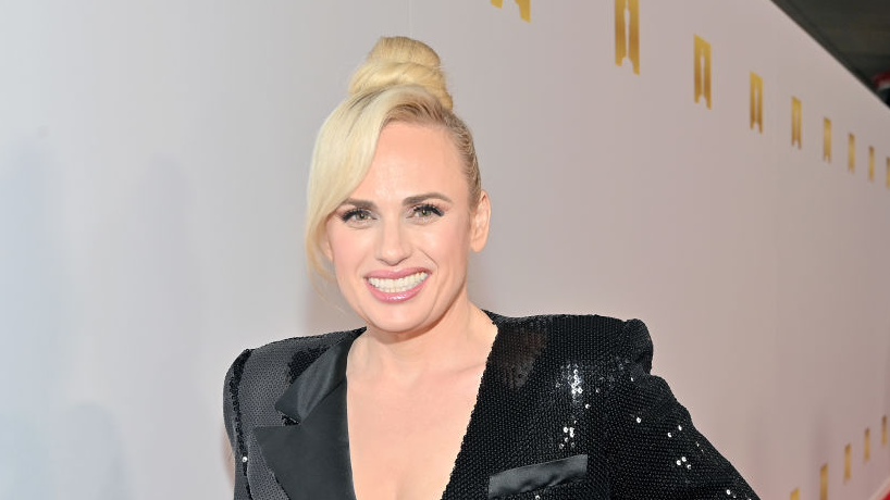 Rebel Wilson puts her slim figure on display in plunging sequin black dress