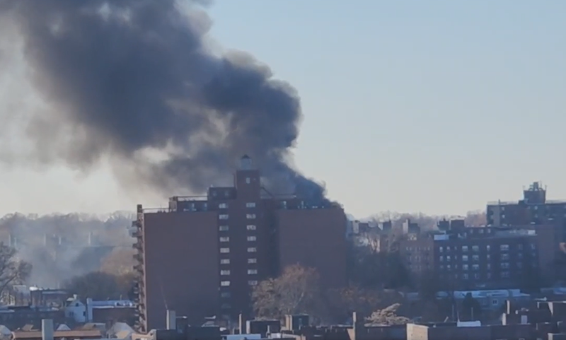 Heavy thick smoke could be seen billowing from the fire site in Rego Park, Queens.