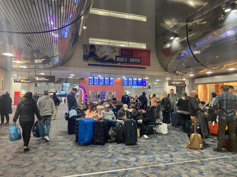 Passengers sit in a waiting area at Reid International Airport