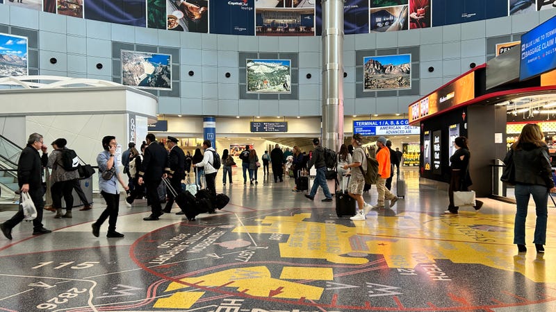 Passengers makes their way to the gate at Reid International Airport.