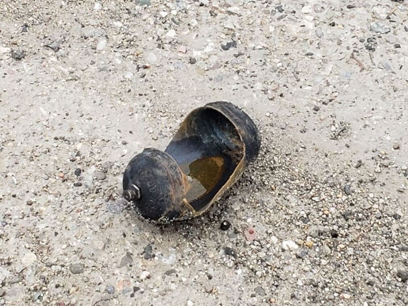 Piece of an exploded cannister.