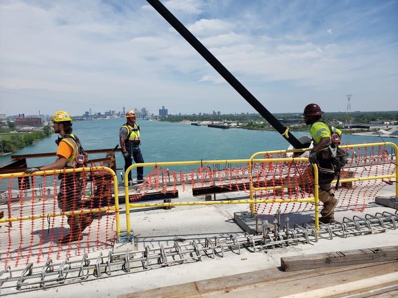 Construction workers on top of Gordie Howe International Bridge