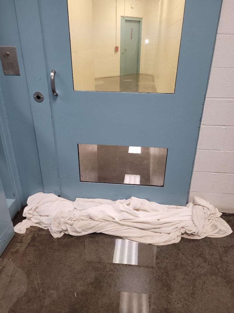 Towels used to contain the water at the St. Louis County Jail
