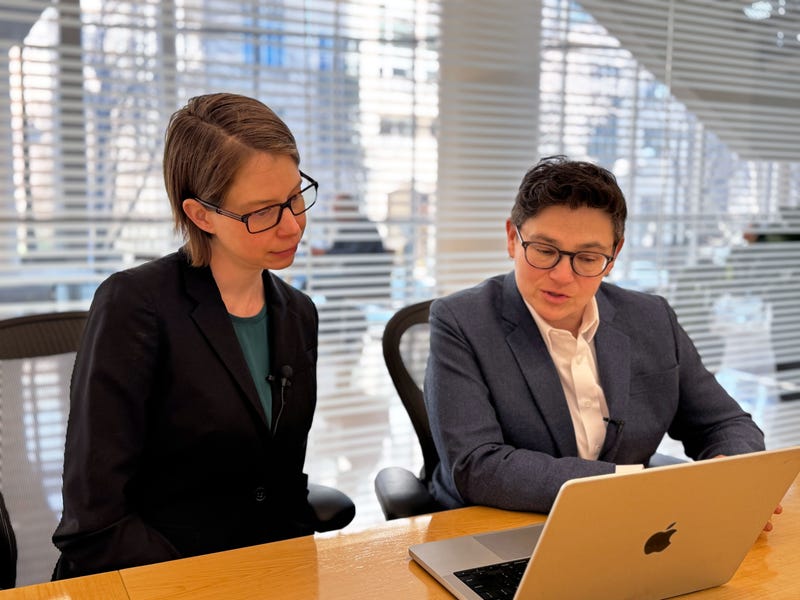 Corresponding author Molly Hales (left) and senior author Tara Lagu (right) review a TikTok video from a study examining TikTok skin care routines