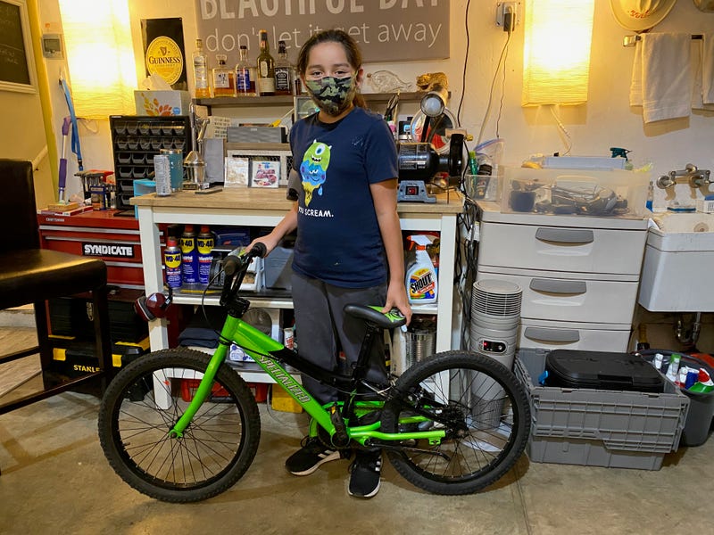 The recipient of an (almost) new bicycle from Kerby’s House of Giving.