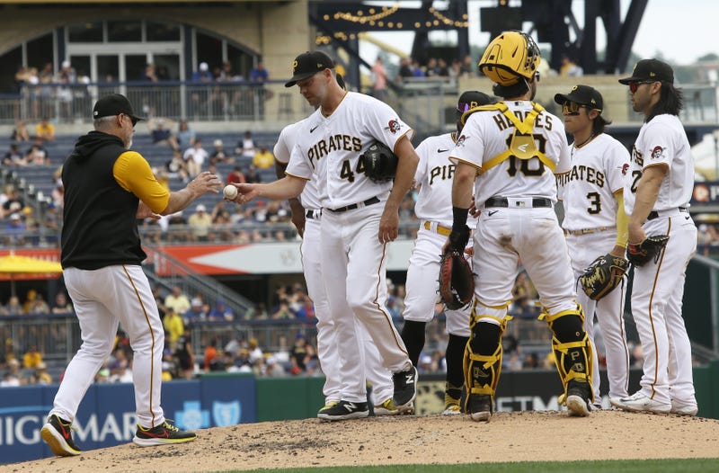 Pirates manager Derek Shelton (left) takes the ball from starting pitcher Rich Hill (44)