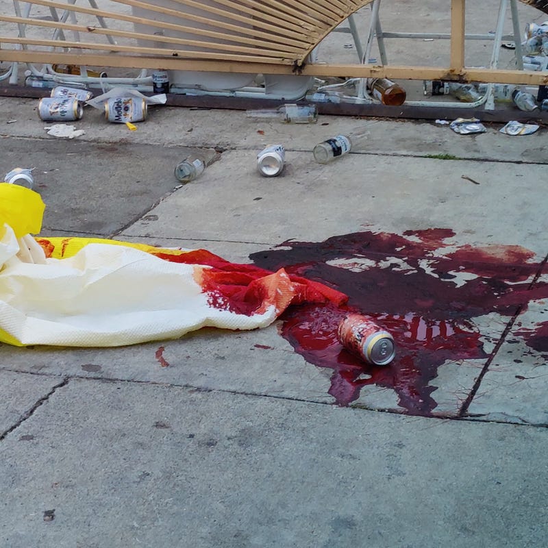 Blood pooling on the sidewalk in front of a home in north Richmond.
