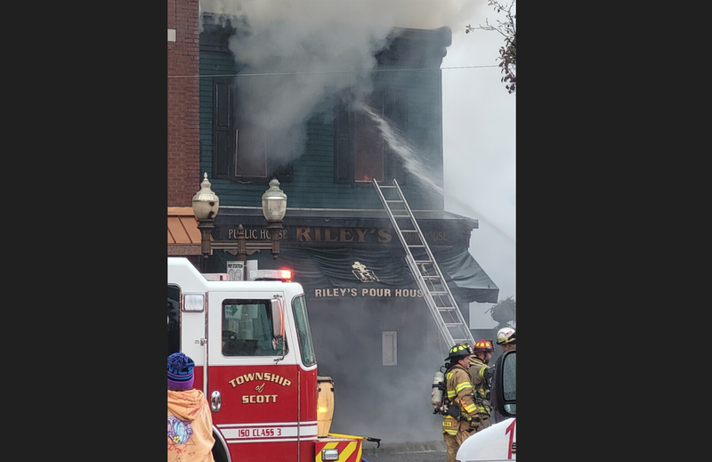 Crews fighting a fire at Riley's Pour House in Carnegie