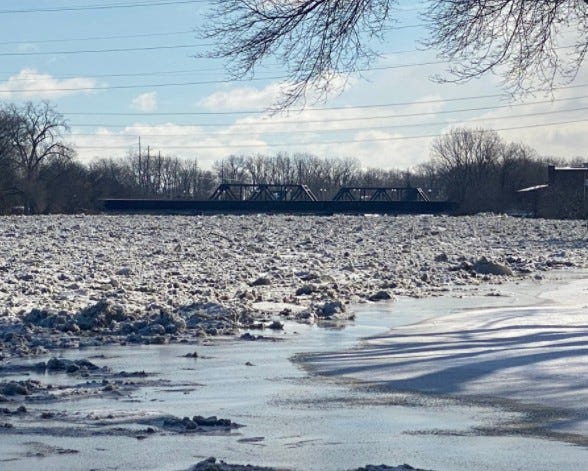 Severe flooding was observed at the River Raisin late Friday night, prompting officials to upgrade earlier flood warnings from moderate to severe.