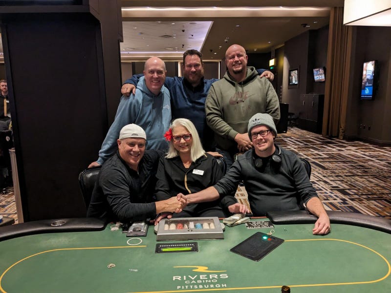 Five of the Texas Hold’em poker players from Rivers Casino Pittsburgh on Nov. 28 who will share a $905,622.13 jackpot. Front row (left to right): Brent Enos, Evelyn Gussenhoffen (dealer) and Scott Thompson. Back row (left to right): Frederick Humelsine, Kevin Graham and Daniel Stefancin.
