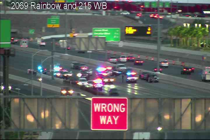 Police block lanes on the 215 Beltway to investigate a road rage incident.