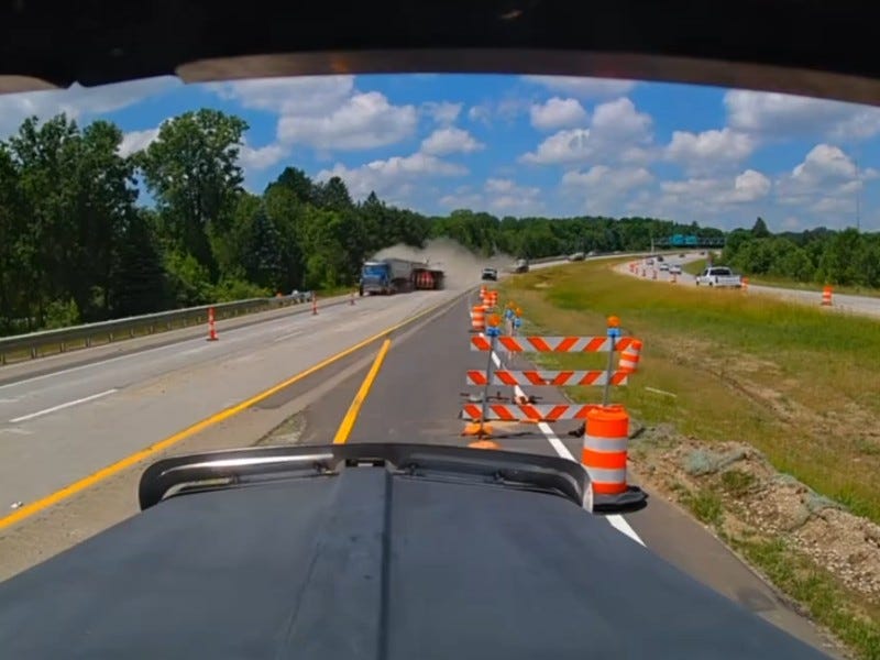 Gravel hauler hits work truck on US-127