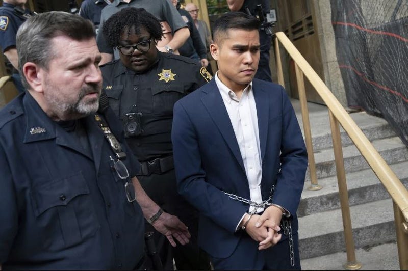New York City Police Department officer Heiu Tran is escorted in handcuffs from Manhattan Criminal Court, Friday, June 7, 2024, in New York. 