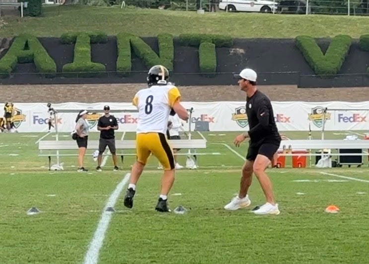 Tom Arth and Aaron Rodgers at training camp