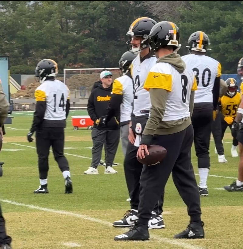 Aaron Rodgers holding a football with brace