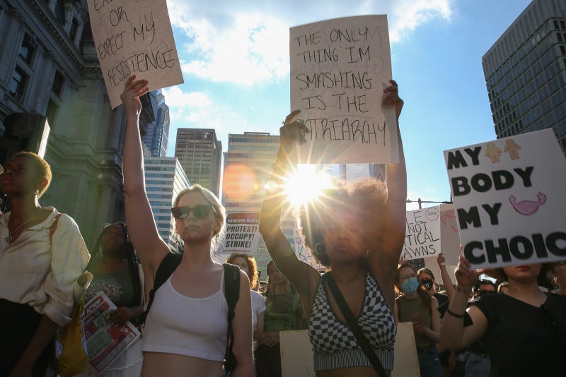 Demonstrators protest agains t SCOTRUS decision to undo Roe v. Wade