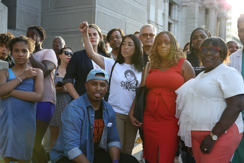 Philadelphia City Councilmember Helen Gym, center, fist raised, stands with Philadelphia State Rep. Elizabeth Fiedler, Philadelphia District Attorney Larry Krasner, Philadelphia City Councilmember Jamie Gauthier and many others