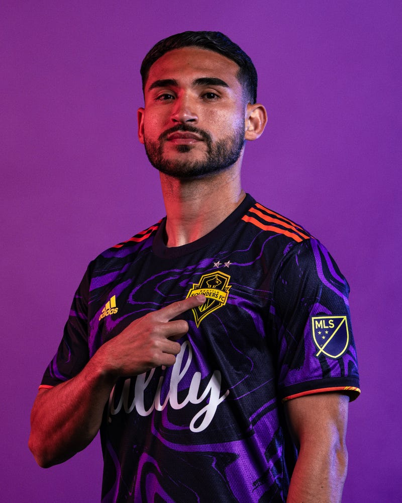 Cristian Roldan modeling the new The Jimi Hendrix Kit for Seattle Sounders FC